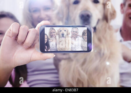 Composite image of hand holding smartphone showing Stock Photo