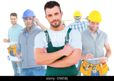 Composite image of carpenter smiling at camera Stock Photo