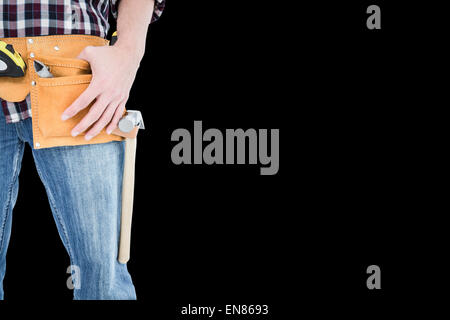 Composite image of handyman wearing tool belt Stock Photo