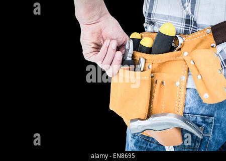 Composite image of technician with tool belt around waist Stock Photo