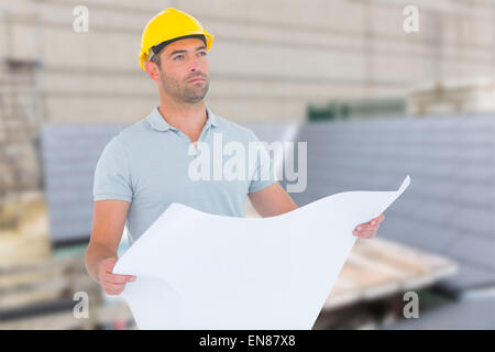 Composite image of thoughtful male architect holding blueprint Stock Photo