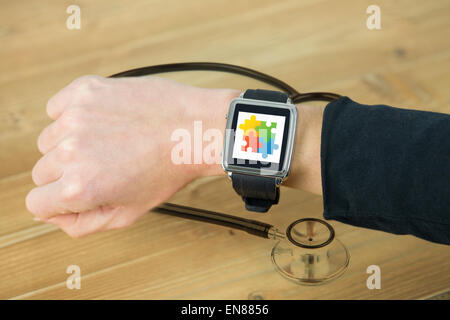 Composite image of businesswoman with smart watch on wrist Stock Photo