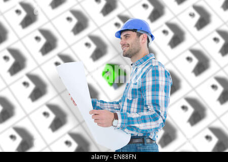 Composite image of smiling engineer looking away while holding blueprint Stock Photo