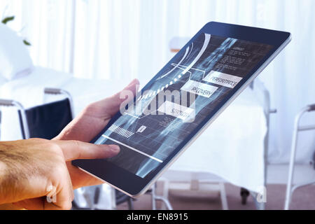Composite image of man using tablet pc Stock Photo