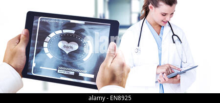 Composite image of man using tablet pc Stock Photo