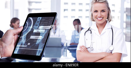 Composite image of man using tablet pc Stock Photo