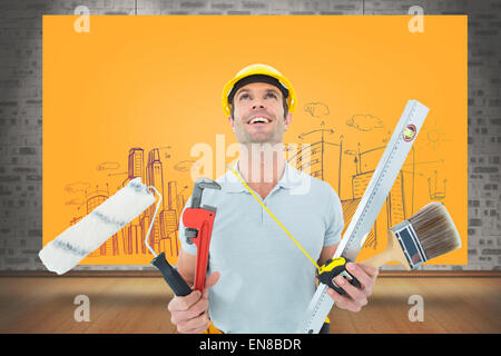 Composite image of worker holding various equipment over white background Stock Photo