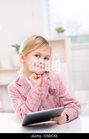Little girl using tablet computer Stock Photo