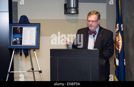 Dr. W. Michael Hawes, vice president, Orion, Lockheed Martin, speaks after accepting the gift of a portion of the writings of Dr. Maya Angelou that were flown aboard the Orion spacecraft during EFT-1 in December of 2014 from Dr. Angelou’s family during a ceremony on Monday, April 6, 2015 at NASA Headquarters in Washington, DC.