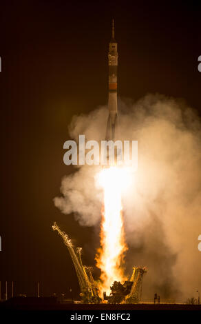 The Soyuz TMA-16M spacecraft is seen as it launches to the International Space Station with Expedition 43 NASA Astronaut Scott Kelly, Russian Cosmonauts Mikhail Kornienko, and Gennady Padalka of the Russian Federal Space Agency (Roscosmos) onboard Saturday, March 28, 2015, Kazakh time (March 27 Eastern time) from the Baikonur Cosmodrome in Kazakhstan. As the one-year crew, Kelly and Kornienko will return to Earth on Soyuz TMA-18M in March 2016.  Photo Credit (NASA/Bill Ingalls) Stock Photo