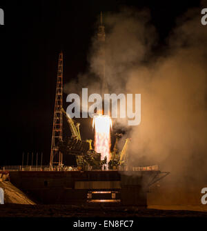 The Soyuz TMA-16M spacecraft is seen as it launches to the International Space Station with Expedition 43 NASA Astronaut Scott Kelly, Russian Cosmonauts Mikhail Kornienko, and Gennady Padalka of the Russian Federal Space Agency (Roscosmos) onboard Saturday, March 28, 2015, Kazakh time (March 27 Eastern time) from the Baikonur Cosmodrome in Kazakhstan. As the one-year crew, Kelly and Kornienko will return to Earth on Soyuz TMA-18M in March 2016.  Photo Credit (NASA/Bill Ingalls) Stock Photo