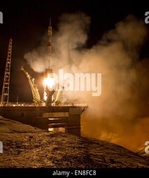 The Soyuz TMA-16M spacecraft is seen as it launches to the International Space Station with Expedition 43 NASA Astronaut Scott Kelly, Russian Cosmonauts Mikhail Kornienko, and Gennady Padalka of the Russian Federal Space Agency (Roscosmos) onboard Saturday, March 28, 2015, Kazakh time (March 27 Eastern time) from the Baikonur Cosmodrome in Kazakhstan. As the one-year crew, Kelly and Kornienko will return to Earth on Soyuz TMA-18M in March 2016.  Photo Credit (NASA/Bill Ingalls) Stock Photo