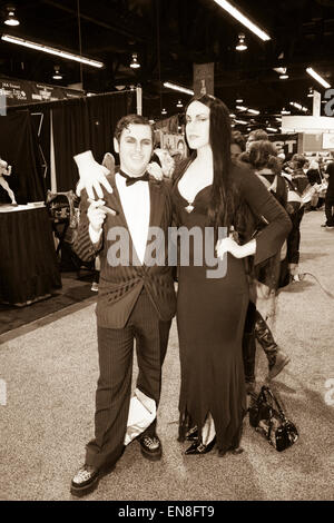 Cosplayers dressed as Morticia and Gomez Addams from the Addams Family TV show and movies at Wondercon in Anaheim California. Stock Photo