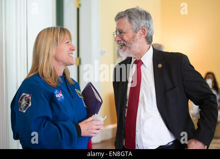 Astronaut Kay Hire, left, speaks to John Holdren, Director, White House Office of Science and Technology Policy, at an event to celebrate the fourth anniversary of Joining Forces, a program that provides support to service members, veterans, and their families on Monday, April 27, 2015 at the Vice President's residence in Washington, DC. At the event, Vice President Biden announced new commitments made to the National Math and Science Initiative (NMSI). NMSI was formed to improve student performance in the critical subjects of science, technology, engineering, and math (STEM) and ensure that n Stock Photo
