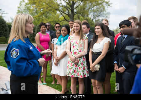 Astronaut Kay Hire speaks to students at an event to celebrate the fourth anniversary of Joining Forces, a program that provides support to service members, veterans, and their families on Monday, April 27, 2015 at the Vice President's residence in Washington, DC. At the event, Vice President Biden announced new commitments made to the National Math and Science Initiative (NMSI). NMSI was formed to improve student performance in the critical subjects of science, technology, engineering, and math (STEM) and ensure that no matter their financial circumstances, race, or gender, all students have  Stock Photo
