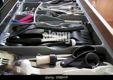 cutlery drawer full of utensils Stock Photo