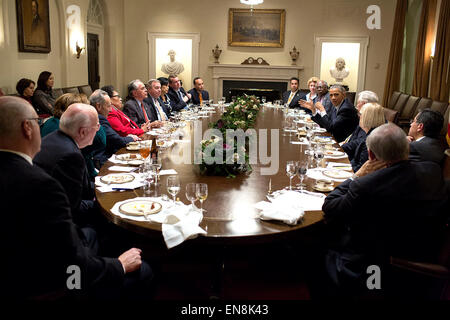 President Barack Obama meets with Members of Congress during dinner in the Cabinet Room, Nov. 19, 2014. Stock Photo