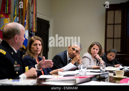 President Barack Obama receives an update on the Ebola outbreak in West Africa and the administrationÕs response efforts, in the Roosevelt Room of the White House, Oct. 6, 2014. Pictured, from left, are: Gen. Martin Dempsey, Chairman of the Joint Chiefs of Staff; Health and Human Services Secretary Sylvia Mathews Burwell; Lisa Monaco, Assistant to the President for Homeland Security and Counterterrorism; National Security Advisor Susan E. Rice; and Homeland Security Jeh Johnson. Stock Photo