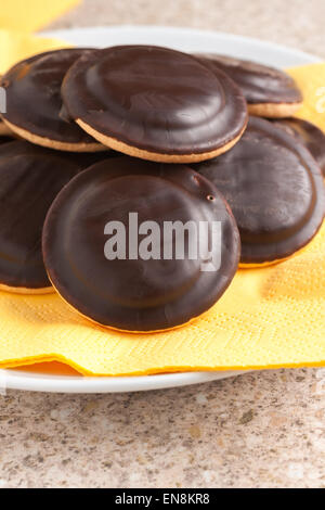 Jaffa cakes a sponge base cake with a layer of orange flavoured jelly coated with dark chocolate Stock Photo