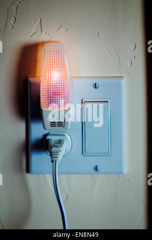 Close up of a night light and electrical outlet in a suburban home Stock Photo