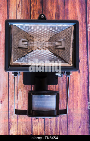 Security lamp mounted on a wooden background Stock Photo