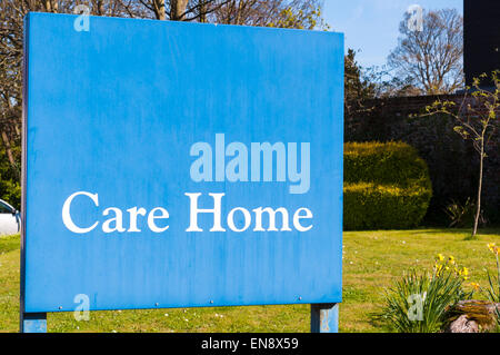Sign for elderly people 'Care Home' at the entrance of a small Suffolk village on a bright sunny day Stock Photo