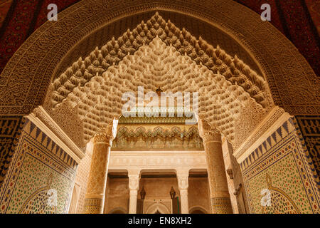 Berber Muqarnas Arabesque stalactite plaster work ceiling and Mocarabe Honeycomb work plaster columns and capitals of the inner  Stock Photo