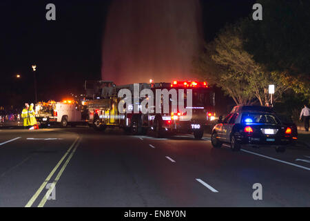 Los Angeles, California, USA. 29th April, 2015. Los Angeles Fire Department Firefighters try to shut of a broken fire hydrant from a hit and run traffic accident. Credit:  Chester Brown/Alamy Live News