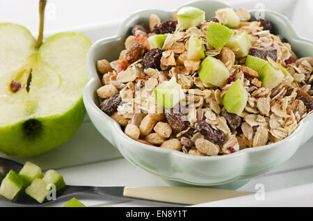Healthy bowl of muesli, green apple for a nealthy breakfast Stock Photo