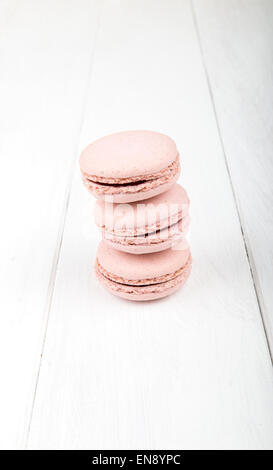 Set of macarons isolated on white wooden table Stock Photo