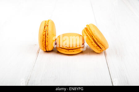 Set of macarons isolated on white wooden table Stock Photo