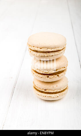 Set of macarons isolated on white wooden table Stock Photo
