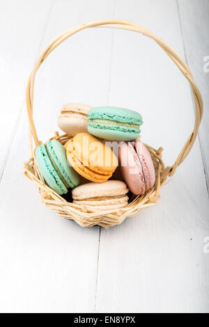 Set of macarons isolated on white wooden table Stock Photo