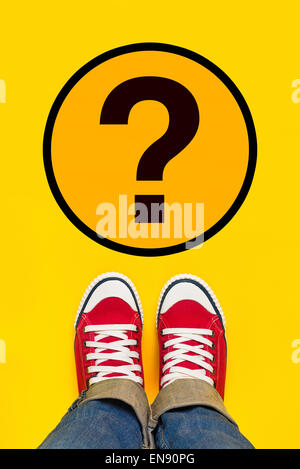 So Many Questions on Young Person Path to Growing Up with Red Sneakers from Above, Top View Stock Photo