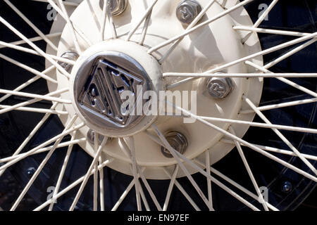Close up of white spoke wire wheel on a vintage Riley car Stock Photo