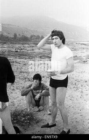 The Rolling Stones. Keith Richards and Charlie Watts seen here posing on Malibu beach. According to the photographers ' The boys had some hamburgers and played football and were happy to be beside the sea' However it was too cold to go swimming. During th Stock Photo