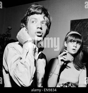 Rolling Stones: Mick Jagger and Chrissie Shrimpton at the wedding of David Bailey and Catherine Deneuve. Mick was best man and this was probably taken at the reception in Soho. 18th August 1965. Stock Photo