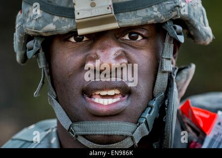 Spc. Kyle Mallory-Johnson with the 366th Engineer Company, poses for a portrait after completing a 4-mile ruck march carrying approximately 65 pounds worth of gear and equipment April 28, 2015 at Fort McCoy, Wisconsin. Stock Photo