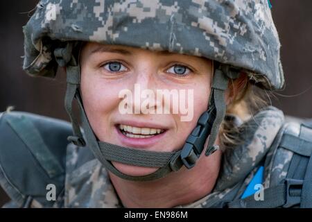 Pfc. Francesca Wolman with the 476th Chemical Battalion poses for a portrait after completing a 4-mile ruck march carrying approximately 65 pounds worth of gear and equipment April 28, 2015 at Fort McCoy, Wisconsin. Stock Photo