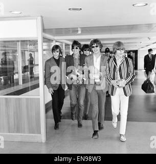 The Rolling Stones leaving for a month long tour of America. Left to right: Charlie Watts, Keith Richards, Bill Wyman, Mick Jagger and Brian Jones. 23rd June 1966. Stock Photo
