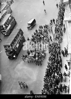 Eve of VE Day celebrations in London at the end of the Second World War. Students from University College London parade their mascot through the streets. 7th May 1945. Stock Photo