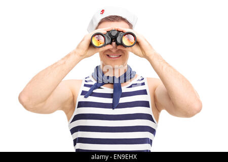 Portrait of a young male sailor looking through binoculars isolated on white background Stock Photo