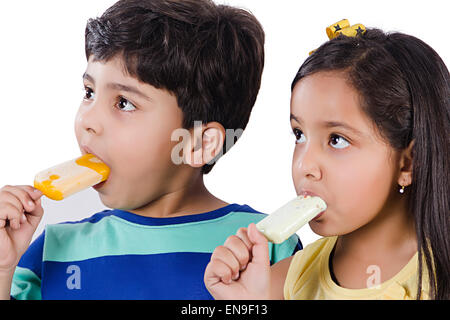 2 indian kids friends Eating  Ice Cream Stock Photo