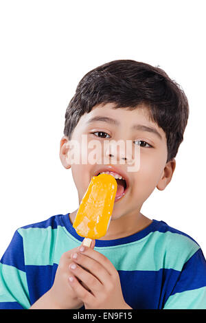 1 indian kids boy Eating Ice Cream Stock Photo