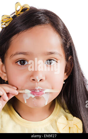 1 indian kids girl Eating Ice Cream Stock Photo