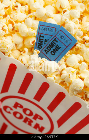 Box of Butter Popcorn with Two Blue Movie Tickets. Stock Photo