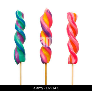 Three Bright and Colorful Twisted Lollipops Isolated on White Background. Stock Photo