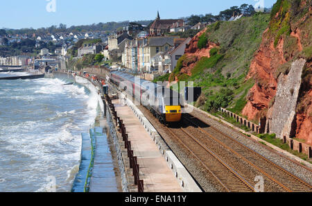 HST express passenger train heading west through Dawlish, Devon, England, UK Stock Photo