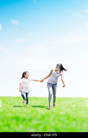 indian mother and daughter park running Stock Photo