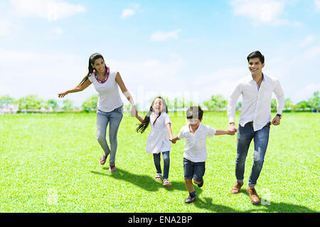 indian Parents and kids  park  Running Stock Photo